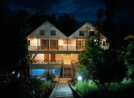 Hillside house at night