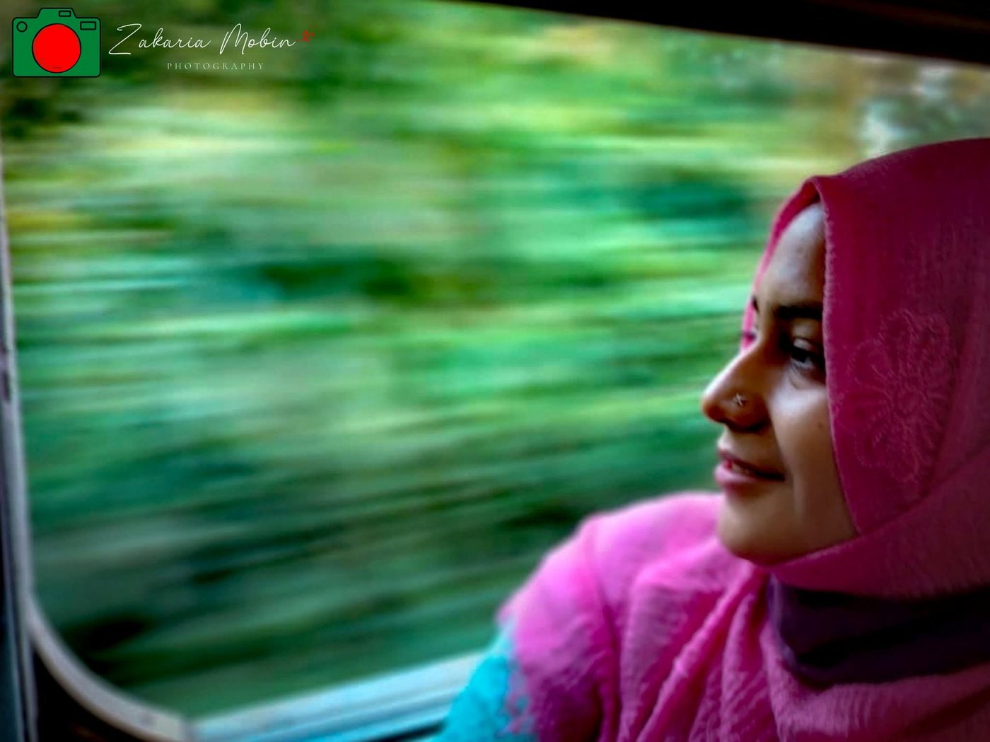 Portrait by a train window