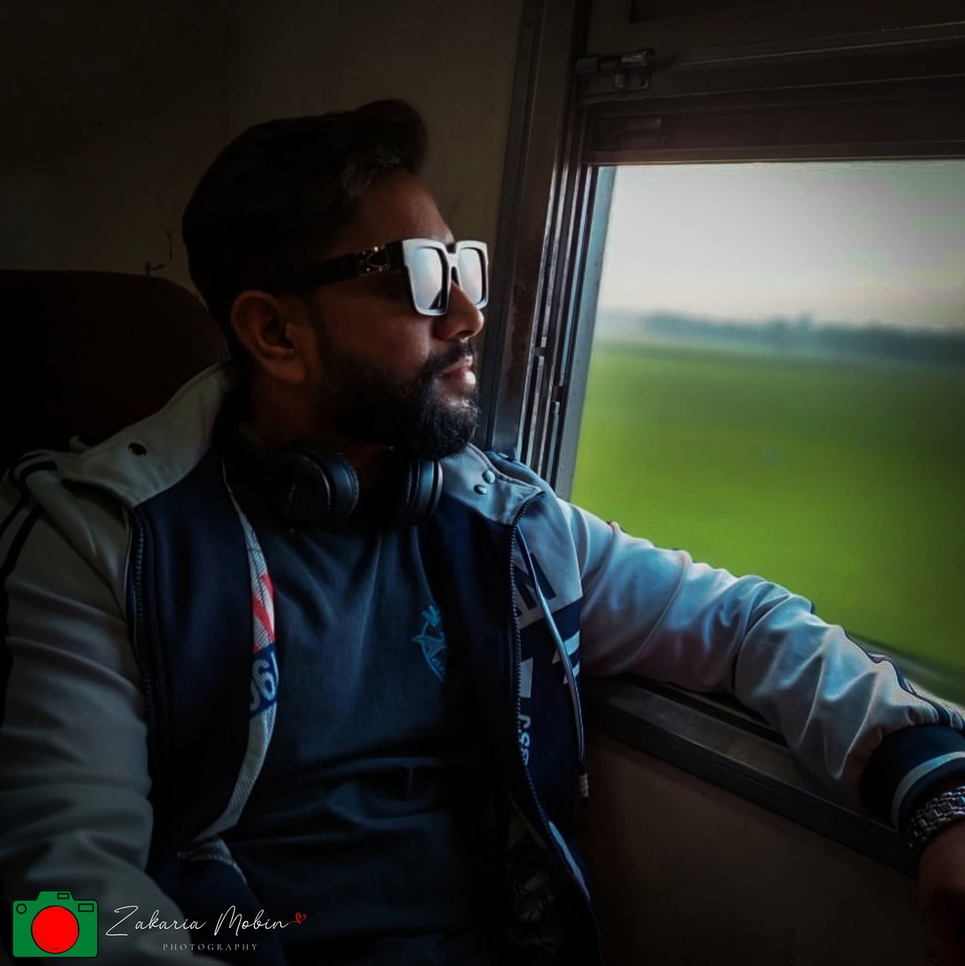 Traveller portrait by a train window